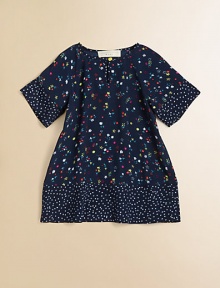 She'll look cuter than ever in this floral-print favorite featuring adorable dotty trim.Split collar with button closureShort sleevesContrast trimViscoseMachine washImported