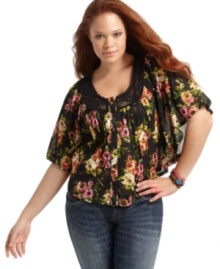 Flaunt your flirty side with ING's butterfly sleeve plus size top, featuring a floral print and lace trim. Flaunt your flirty side with ING's butterfly sleeve plus size top, featuring a floral print and lace trim.