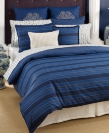 Classic comfort meets modern styling. This Westerly Stripe duvet cover set from Tommy Hilfiger features a landscape of blue stripes that reverse to a navy background with an ivory dot circle pattern. Button closure. Classic comfort meets modern styling. This Westerly Stripe duvet cover set from Tommy Hilfiger features a landscape of blue stripes that reverse to a navy background with an ivory dot circle pattern. Button closure.