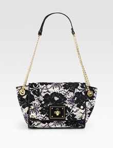 A sophisticated leather style with feminine flair and a roomy interior.Chain and leather shoulder strap, 10½ dropTurnlock flap closureOne inside zip pocketSatin lining12W X 6½H X 4DImported A sophisticated leather style with feminine flair and a roomy interior.Chain and leather shoulder strap, 10½ dropTurnlock flap closureOne inside zip pocketSatin lining12W X 6½H X 4DImported