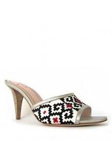 A kitschy, geometric needlepoint design is dressed up with shimmering, metallic leather trim on plenty by tracy reese's Zula slides, an effortless style with major character.