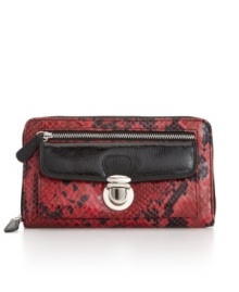 Vibrant red glazzed snakeskin embellishes this chic wallet from Style&co., and the two front pockets - one zip, one pushlock - gives it trendy functionality. Vibrant red glazzed snakeskin embellishes this chic wallet from Style&co., and the two front pockets - one zip, one pushlock - gives it trendy functionality.