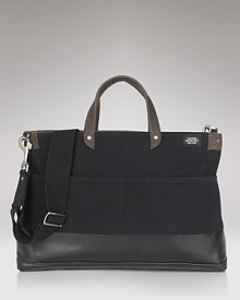 A sleek Jack Spade bag that means business. Hand-dipped in rubber latex with a reinforced, waterproof bottom for durability . A sleek Jack Spade bag that means business. Hand-dipped in rubber latex with a reinforced, waterproof bottom for durability .