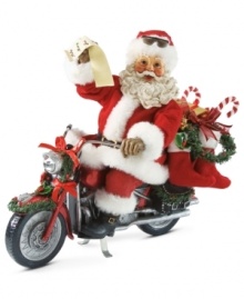 Look who's got a new set of wheels! Santa is delivering gifts on his decked out motorcycle, complete with festive ribbon, garland and stockings.