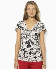 Crafted from lightweight tissue cotton in a figure-flattering faux-wrap design, This Lauren by Ralph Lauren top defines modern femininity in a bold floral-print.