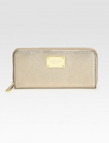 Stay organized with this sleek continental design, crafted from metallic pebble-grain leather.Zip-around closure Center zip compartment Two bill compartments Four credit card slots Logo-print lining 8W X 4H X 1/2D Imported Stay organized with this sleek continental design, crafted from metallic pebble-grain leather.Zip-around closure Center zip compartment Two bill compartments Four credit card slots Logo-print lining 8W X 4H X 1/2D Imported