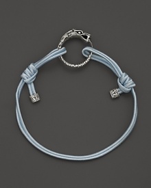 Eastern elements inform John Hardy's dragon head bracelet. It features a cotton cord band with an adjustable sliding closure. Eastern elements inform John Hardy's dragon head bracelet. It features a cotton cord band with an adjustable sliding closure.