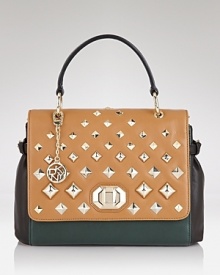 A ladylike shape with pyramid studding are a modern mash-up on DKNY's structured handbag. A ladylike shape with pyramid studding are a modern mash-up on DKNY's structured handbag.