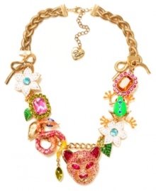 Turn on the charm with this funky frontal necklace from Betsey Johnson. Fabulously flaunts gold tone bows, tiger accented with pink-colored crystals, green frog with blue-colored crystals, pink and orange rectangular gems with crystal accents, green and gold tone leaves, snake with crystal accents and white flowers with crystal accents. Crafted in gold-plated mixed metal. Approximate length: 18 inches + 3-inch extender. Approximate drop: 1-3/4 inches. Turn on the charm with this funky frontal necklace from Betsey Johnson. Fabulously flaunts gold tone bows, tiger accented with pink-colored crystals, green frog with blue-colored crystals, pink and orange rectangular gems with crystal accents, green and gold tone leaves, snake with crystal accents and white flowers with crystal accents. Crafted in gold-plated mixed metal. Approximate length: 18 inches + 3-inch extender. Approximate drop: 1-3/4 inches.