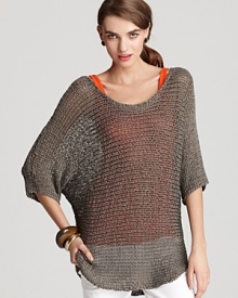 A sheer Vince sweater with reflective gold thread detail makes a glamorous fashion statement from the beach to the big city, endlessly chic with neutral-hued separates that off-set its gorgeous glow. Layer over a bold-colored tank for forward flair or keep the look neutral and choose a nude cami.