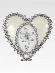 A lovely way to display a photo of one close to your heart, this charming frame of pearly enamel is edged with shimmering Swarovski crystals and silvery accents.Enamel and crystalWhite bronze finishHandmade, hand-enameled and hand-set4.5W X 4.5HMade in USA A lovely way to display a photo of one close to your heart, this charming frame of pearly enamel is edged with shimmering Swarovski crystals and silvery accents.Enamel and crystalWhite bronze finishHandmade, hand-enameled and hand-set4.5W X 4.5HMade in USA
