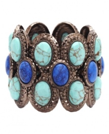 Take your look up a notch in Monet's Show Stopper cuff bracelet. Three rows of beautiful blue and reconstituted turquoise beads stand out against a bronze tone mixed metal background. Approximate diameter: 2-1/4 inches.