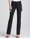 Sleek tailoring and classic styling make these MICHAEL Michael Kors bootcut pants the foundation to your workweek style.