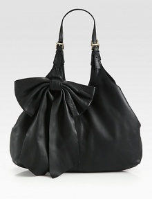A feminine design with a slouchy chic style in supple leather accented with a large bow.Double adjustable shoulder straps, 9½-12½ dropMagnetic snap closure with center strapOne inside zip pocketCotton lining16W X 11½H X 4DMade in Italy A feminine design with a slouchy chic style in supple leather accented with a large bow.Double adjustable shoulder straps, 9½-12½ dropMagnetic snap closure with center strapOne inside zip pocketCotton lining16W X 11½H X 4DMade in Italy