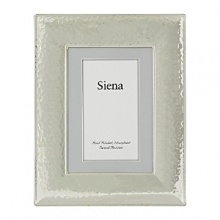 The Siena frame from Tizo features a distinctive hammered texture reminiscent of traditional metalworking techniques. The Siena frame from Tizo features a distinctive hammered texture reminiscent of traditional metalworking techniques.
