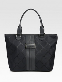 This two-tone leather accented signature jacquard design is the perfect roomy carryall for all your daily essentials.Double leather shoulder straps, 8 dropTop zip closureProtective metal feetOne inside zip pocketFive inside open pocketsFully lined12½W X 11H X 5DImported This two-tone leather accented signature jacquard design is the perfect roomy carryall for all your daily essentials.Double leather shoulder straps, 8 dropTop zip closureProtective metal feetOne inside zip pocketFive inside open pocketsFully lined12½W X 11H X 5DImported