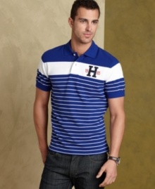 Bold stripes step up the classic design of this slim-fit Tommy Hilfiger polo shirt for standout style that can't be ignored.