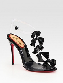 Pretty patent leather bows add feminine style to this chic t-strap silhouette of translucent PVC. Patent leather-covered heel, 4¼ (110mm)Patent leather and PVC upperAnkle strap with snap closurePatent leather liningSignature red leather solePadded insoleMade in Italy Pretty patent leather bows add feminine style to this chic t-strap silhouette of translucent PVC. Patent leather-covered heel, 4¼ (110mm)Patent leather and PVC upperAnkle strap with snap closurePatent leather liningSignature red leather solePadded insoleMade in Italy