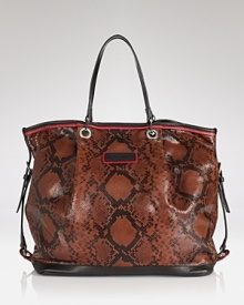 Nod to this season's exotic trend with Longchamp's embossed leather tote. With double top handles and a spacious shape, this daytime bag tips the scales. Nod to this season's exotic trend with Longchamp's embossed leather tote. With double top handles and a spacious shape, this daytime bag tips the scales.