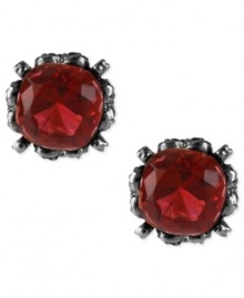 Red haute. This set of stud earrings from Betsey Johnson is crafted from hematite-tone mixed metal and features a red gem in the center for a stylish statement. Approximate drop: 1/2 inch.