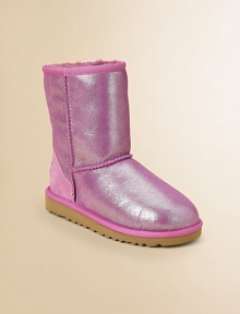Glitter adorns this update on the original Ugg design, in sheepskin to keep feet warm, dry and in style all season long.Pull-on styleSheepskin upperSheepskin liningMolded EVA sole is light and flexiblePadded insoleImported Glitter adorns this update on the original Ugg design, in sheepskin to keep feet warm, dry and in style all season long.Pull-on styleSheepskin upperSheepskin liningMolded EVA sole is light and flexiblePadded insoleImported