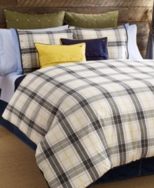 Tommy Hilfiger's Lake George duvet cover set features a classic plaid design in olive, blue and ivory tones accented with pops of yellow. Finished with blue tape binding for a clean look. Reverses to solid. Tommy Hilfiger's Lake George duvet cover set features a classic plaid design in olive, blue and ivory tones accented with pops of yellow. Finished with blue tape binding for a clean look. Reverses to solid.