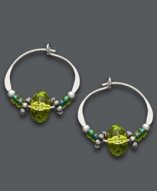 Traditional hoops with a springtime touch. Jody Coyote combines a petite sterling silver hoop setting with vibrant crystal beads in bright green hues. Approximate diameter: 5/8 inch.