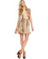 A rich snakeskin print adds animal-cool to a wispy chiffon dress from Kensie designed for navigating urban jungles.