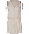 Sumptuous dress of fine cream-colored synthetic fiber - outstanding wonderful quality - fashionable tunic cut, with decorative shoulder design, V-decollete and accentuated tailoring - form fitting, short length - easy style, trendy, sexy - Party time: wear it with a biker jacket and gladiator sandals, or at the beach with slip-on sandals and a straw hat