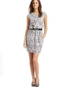 Modern abstract printed crepe fuses with a contrast scoopneck knit for a sophisticated take on layered dressing.Sweetheart and draped bow details One shoulder illusion front Short sleeves Slim elastic belt with jeweled buckle Pleated front skirt About 36 from shoulder to hem Silk Dry clean Made in USA