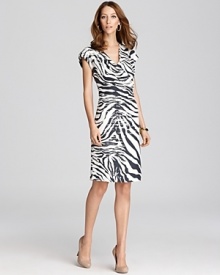 A wild zebra print takes to a tame Lafayette 148 New York sheath for a refined walk on the wild side. A wild zebra print takes to a tame Lafayette 148 New York sheath for a refined walk on the wild side.