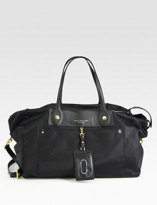 Lightweight nylon and luxurious leather come together in the perfect travel style.Double leather top handles, 8½ dropDetachable adjustable leather shoulder strap, 22-24 dropTop zip closureTwo outside open pocketsOne inside zip pocketTwo inside open pocketsFully lined11½W X 13H X 8DImported Lightweight nylon and luxurious leather come together in the perfect travel style.Double leather top handles, 8½ dropDetachable adjustable leather shoulder strap, 22-24 dropTop zip closureTwo outside open pocketsOne inside zip pocketTwo inside open pocketsFully lined11½W X 13H X 8DImported