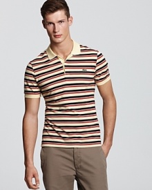 With a vibrant punch of multicolored stripes, this classic polo from Lacoste gets a stylish-yet-edgy update. With a vibrant punch of multicolored stripes, this classic polo from Lacoste gets a stylish-yet-edgy update.