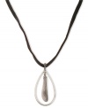 A fine feathered friend. This pendant necklace from Lucky Brand features an oblong design with a feather accent. Strung from a leather cord. Crafted in silver tone mixed metal. Approximate length: 33 inches. Approximate drop: 2-3/4 inches.