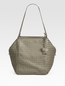 Sumptuous leather intricately woven in a roomy top handle carryall.Double top handles, 10½ dropTop zip closureOne inside zip pocketOne inside open pocketSuede lining17W X 10¾H X 9½DMade in Italy Sumptuous leather intricately woven in a roomy top handle carryall.Double top handles, 10½ dropTop zip closureOne inside zip pocketOne inside open pocketSuede lining17W X 10¾H X 9½DMade in Italy