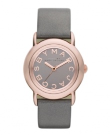 Tastefully trendy. The perfect amount of shimmer and shine accents this watch by Marc by Marc Jacobs. Metallic gray leather strap and round rose-gold ion-plated stainless steel case. Gray mirrored dial features rose-gold tone logo letters at markers and three hands. Quartz movement. Water resistant to 50 meters. Two-year limited warranty. Tastefully trendy. The perfect amount of shimmer and shine accents this watch by Marc by Marc Jacobs. Metallic gray leather strap and round rose-gold ion-plated stainless steel case. Gray mirrored dial features rose-gold tone logo letters at markers and three hands. Quartz movement. Water resistant to 50 meters. Two-year limited warranty.