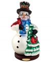 Get festive with a frosty snowman figurine. Hand-painted glass captures the bright essence of the season in traditional Christopher Radko style.