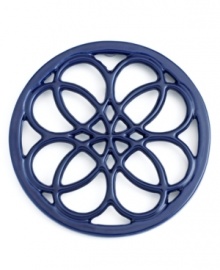 This quaint cast iron trivet, a charming piece to place on any countertop or dining table, features a classic pattern that protects virtually any surface from hot pots and pans. Limited lifetime warranty. This quaint cast iron trivet, a charming piece to place on any countertop or dining table, features a classic pattern that protects virtually any surface from hot pots and pans. Limited lifetime warranty.