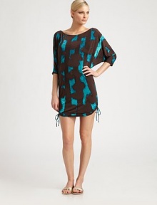 All-around chic, a coverup with an elegant print and flattering ruched sides with side ties for a more customized fit.Feminine rounded necklineElbow-length sleevesSelf ties on ruched sides92% polyester/8% spandexCurved hemHand washImported All-around chic, a coverup with an elegant print and flattering ruched sides with side ties for a more customized fit.Feminine rounded necklineElbow-length sleevesSelf ties on ruched sides92% polyester/8% spandexCurved hemHand washImported
