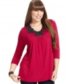 Dress up your casual style with ING's three-quarter-sleeve plus size top, accented by an embellished neckline.