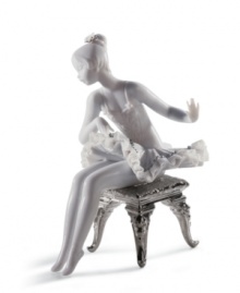 This young ballerina has graceful poise, even while primping for her moment on stage. With lustrous silver leaf accents and an intricate lace trimmed tutu, this hand-painted figurine is a beautiful gift for any aspiring dancer. 6 x 4.75. This young ballerina has graceful poise, even while primping for her moment on stage. With lustrous silver leaf accents and an intricate lace trimmed tutu, this hand-painted figurine is a beautiful gift for any aspiring dancer. 6 x 4.75.