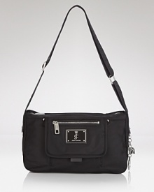 Glamor-girl brand Juicy Couture takes a practical approach to accessorizing with this nylon satchel. Packed with pockets and ideally sized for days on the go, it perfects effortless style. Glamor-girl brand Juicy Couture takes a practical approach to accessorizing with this nylon satchel. Packed with pockets and ideally sized for days on the go, it perfects effortless style.