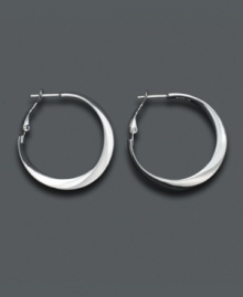 Perfectly versatile, with just a touch of flair. Twisted sterling silver makes these hoops a new favorite. Approximate diameter: 1 inch. Perfectly versatile, with just a touch of flair. Twisted sterling silver makes these hoops a new favorite. Approximate diameter: 1 inch.