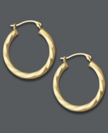 Put a positive spin on it. Traditional hoops take on a sweet, new look with a subtle twisted design in polished 18k gold. Approximate diameter: 3/4 inch. Put a positive spin on it. Traditional hoops take on a sweet, new look with a subtle twisted design in polished 18k gold. Approximate diameter: 3/4 inch.