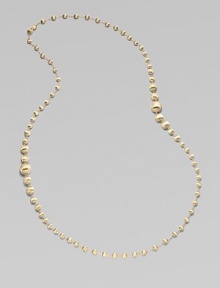 An elegant strand of brushed 18k yellow gold beads.18k yellow gold Length, about 36 Lobster clasp Made in Italy An elegant strand of brushed 18k yellow gold beads.18k yellow gold Length, about 36 Lobster clasp Made in Italy