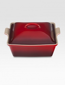 Crafted from heavy stoneware, Le Creuset cookware is the ultimate ingredient for chefs and home cooks worldwide. With its secure lid, this covered casserole is a convenient choice for transporting dishes to parties and picnics. Not only does the lid provide an effective moisture and heat lock for the dish, but it prevents spills and protects its contents. Crafted from heavy stoneware, Le Creuset cookware is the ultimate ingredient for chefs and home cooks worldwide. With its secure lid, this covered casserole is a convenient choice for transporting dishes to parties and picnics. Not only does the lid provide an effective moisture and heat lock for the dish, but it prevents spills and protects its contents.