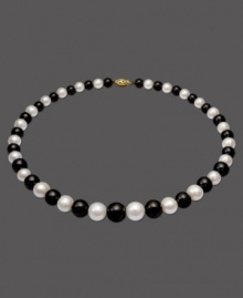 The perfect picture of contrast. This necklace features a strand of alternating cultured freshwater pearls (8-12 mm) and onyx  beads (8-12 mm). Set in 14k gold. Approximate length: 18 inches.