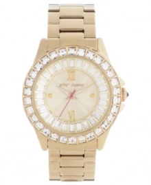 Swirling rings of glistening crystals add a luxe touch to this golden watch from Betsey Johnson.