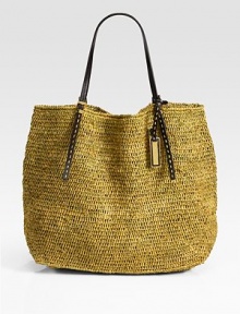 Lightweight and roomy, this chic carryall is crafted from finely-woven raffia and topped with rich leather handles.Double top handles, 9½ dropGoldtone logo tag20W X 14½H X 7DImported; straw origin: Madagascar Lightweight and roomy, this chic carryall is crafted from finely-woven raffia and topped with rich leather handles.Double top handles, 9½ dropGoldtone logo tag20W X 14½H X 7DImported; straw origin: Madagascar