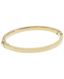 Dress up your look with a simple layer. Michael Kors thin polished bangle looks great solo, but is perfect for stacking! Crafted in gold tone mixed metal. Approximate width: 1/8 inch. Approximate diameter: 2-1/4 inches.